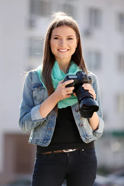 Beautiful young photography take photos outdoors on city street