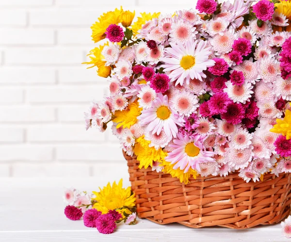 Beautiful flowers in wicker basket