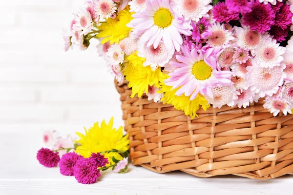 Beautiful flowers in wicker basket