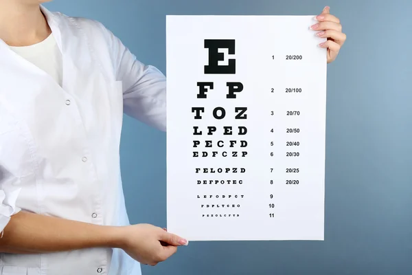 Woman with eye chart