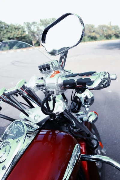 Motorcycle detail with gasoline tank and speedometer.