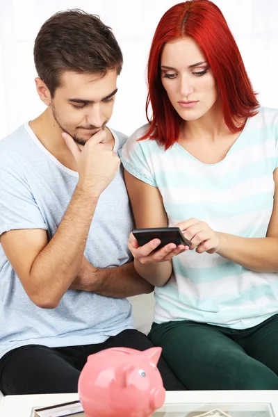 Loving couple sitting in sofa