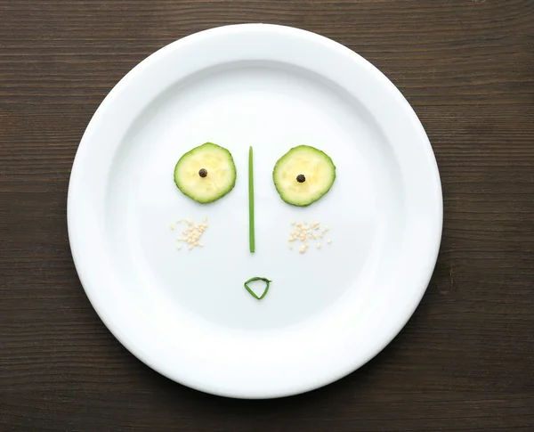 Vegetable face on plate