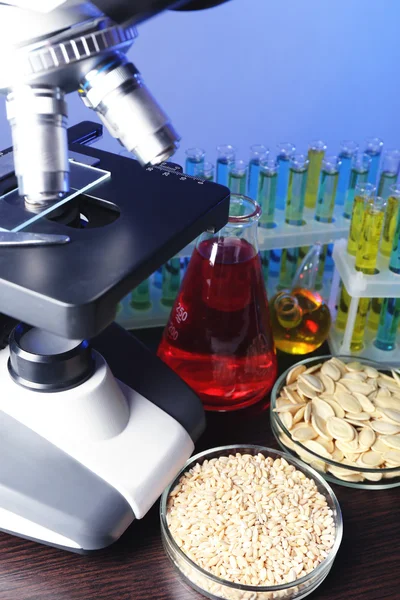 Microscope, grains and test tubes