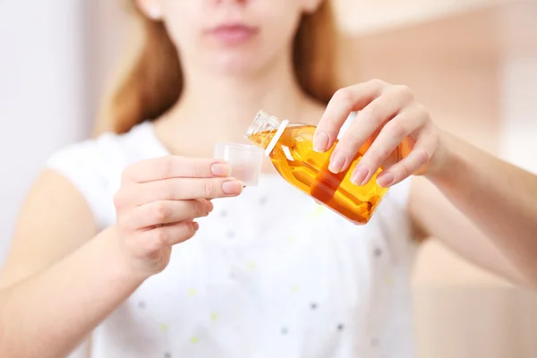 Female with Cough syrup