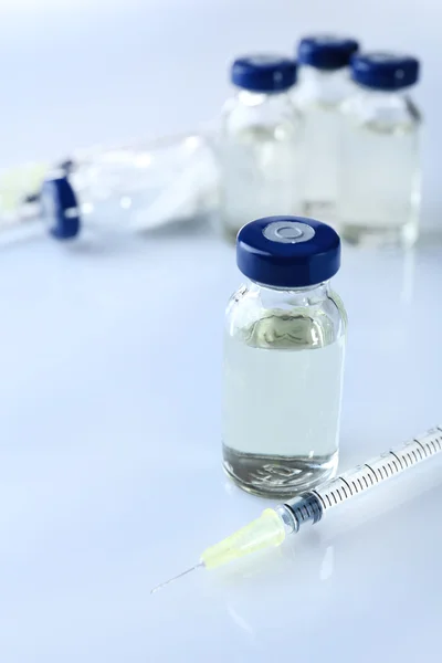 Vaccine in vial with syringe