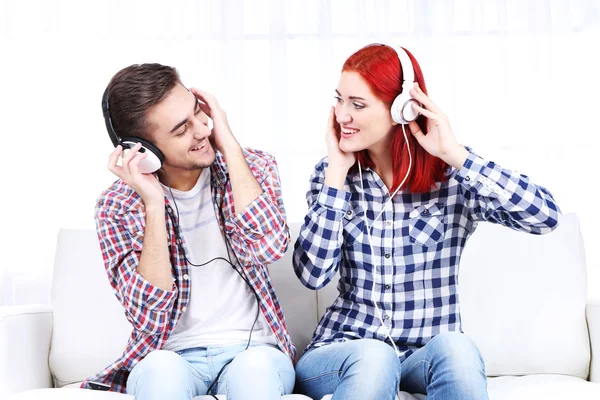 Couple listen to music at home