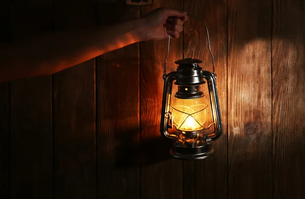 Vintage lantern in hands