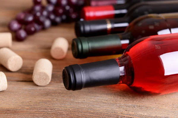 Different bottles of wine on table close-up