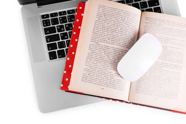 Laptop, open book and computer mouse on white background