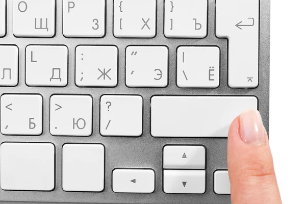 Female finger with keyboard on white background
