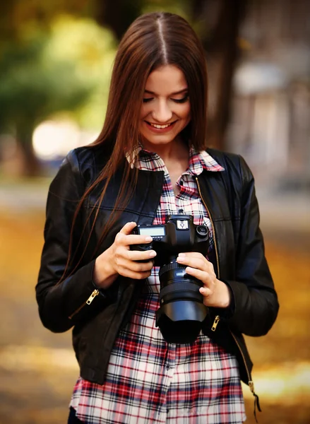 Young photographer taking photos outdoors