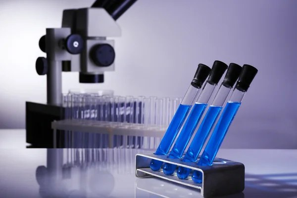 Laboratory glassware with blue liquid