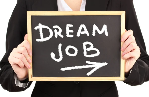 Young businesswoman holding blackboard with Dream Job text on it