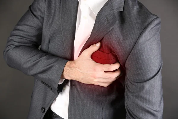 Man having chest pain - heart attack close up