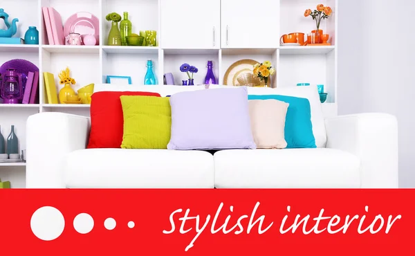 Modern interior design. White living room with sofa and bookcase. Stylish interior concept