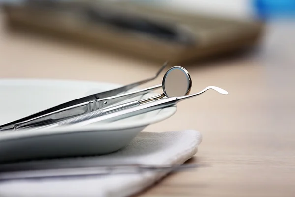 Set dentist tools on tray on table close up