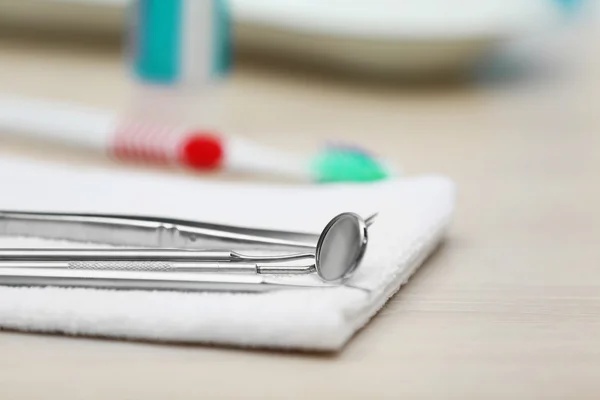 Set dentist tools on napkin on table close up