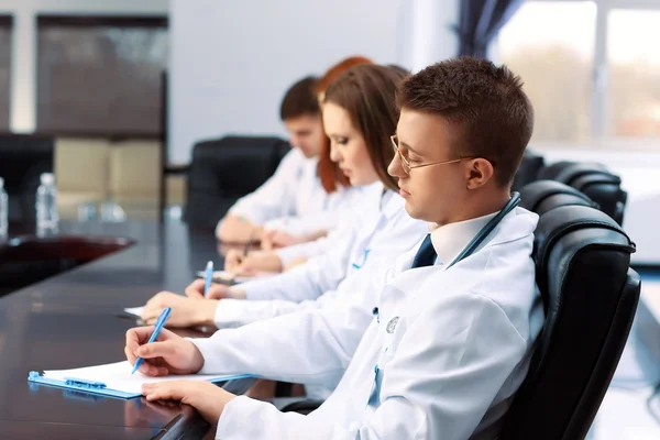 Medical workers working in conference room