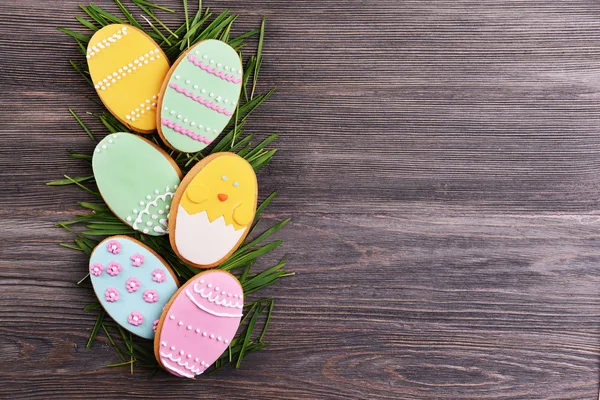 Delicious Easter cookies on wooden background