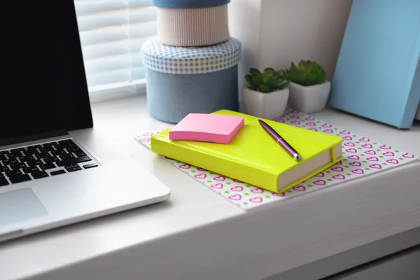 Laptop, notebook on windowsill. Working place concept