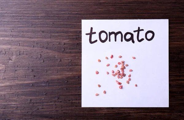 Tomato seeds on piece of paper