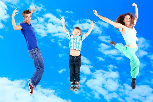 Jumping people on sky background