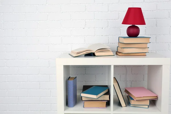 Wooden shelf with books