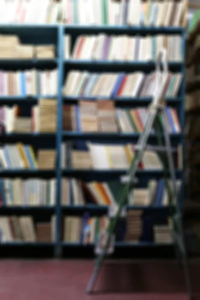 Many books on bookshelf in library