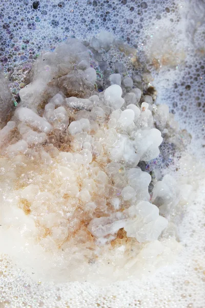 Crystals of sea salt from Dead Sea coast, close-up