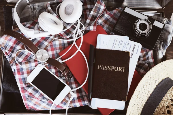 Packed suitcase of vacation items