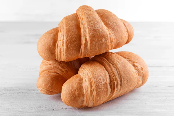 Delicious croissants on table