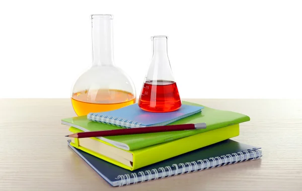 Desk with books and test tubes