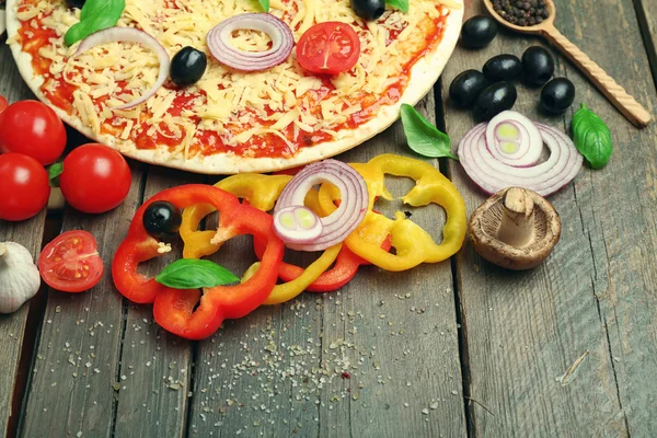 Food ingredients for pizza on table close up