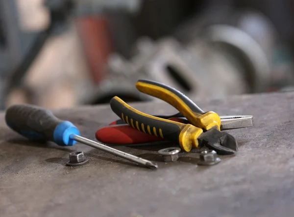 Different tools on workplace in garage