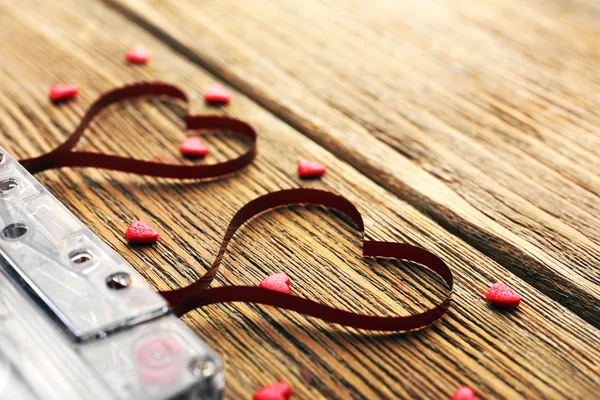 Audio cassette with magnetic tape in shape of hearts