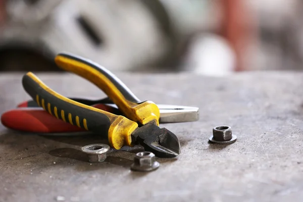 Different tools on workplace in garage