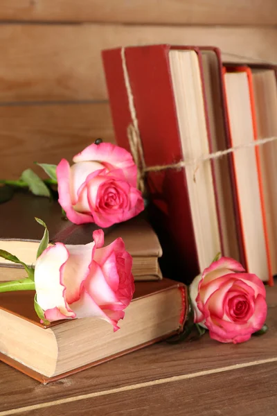 Tied books with pink roses
