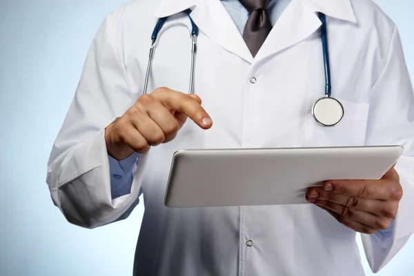 Male doctor with tablet close up