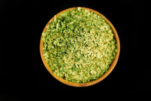 Dried parsley in wooden bowl