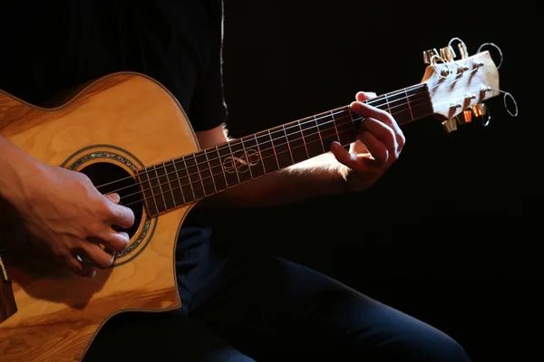 Man playing on guitar