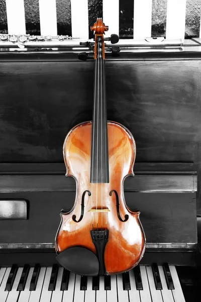 Violin on piano background