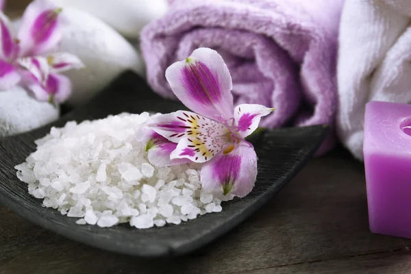 Spa still life with purple flowers, closeup