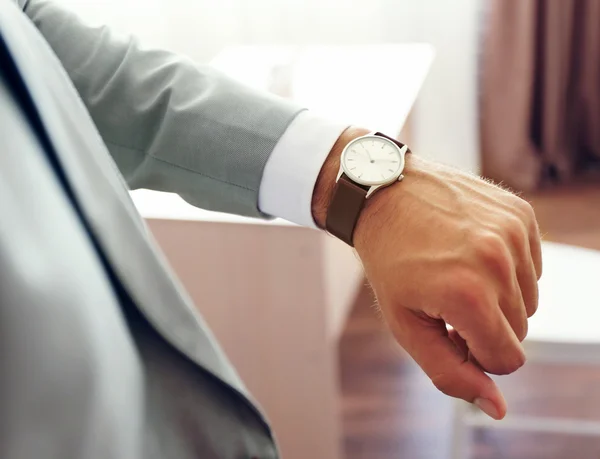 Businessman looking at his watch