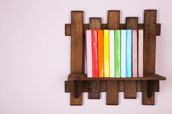 Wooden shelf with books