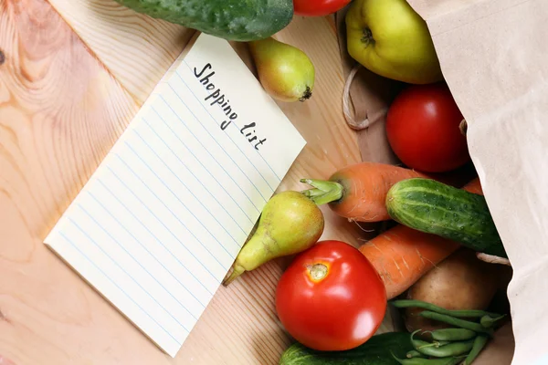 Fruits and vegetables with shopping list