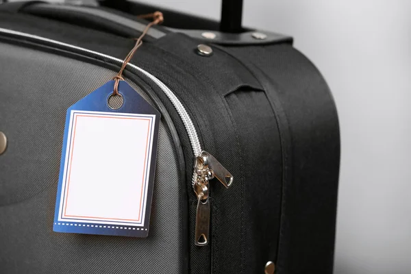 Suitcase with TRAVEL INSURANCE label