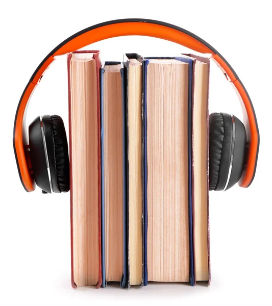Books and headphones as audio books concept isolated on white
