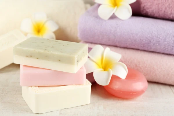 Bars of natural soap and colorful towels