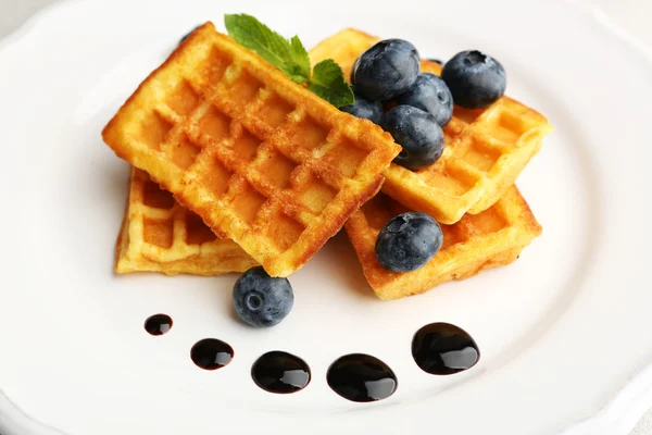 Sweet homemade waffles with forest berries